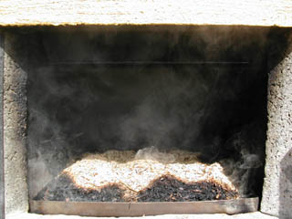 Then the smoke oven is lit