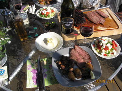 Roast rump steak on the grill with accessories
