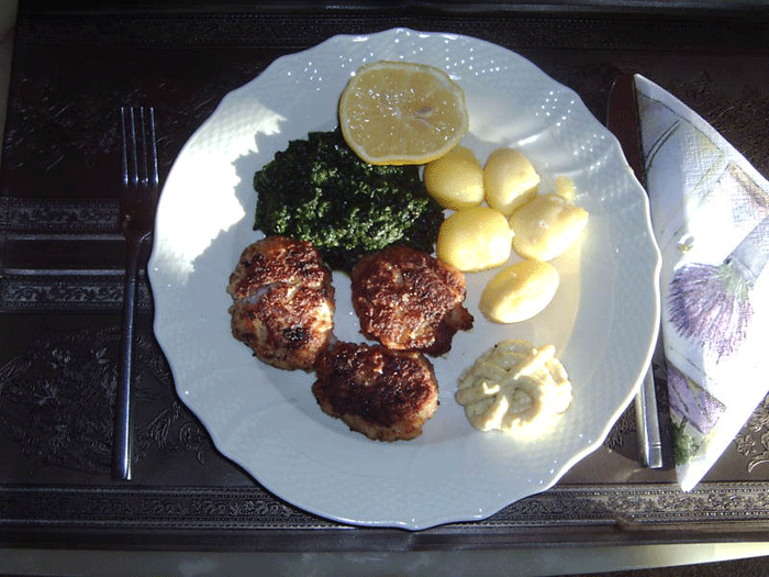 Fish meatballs served with cream stewed spinach and new potatoes