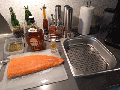 Fresh salmon 600 g ready for salting with Whisky. The salmon has received the 2.6% mixture on the left
