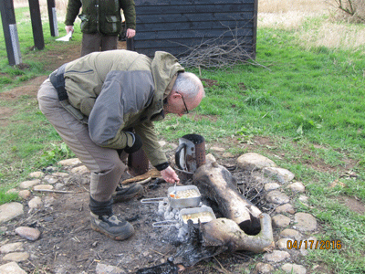 Bumble lights the fire for his brought-in soup