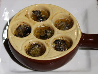 Escargots then baked in butter, garlic and parsley 