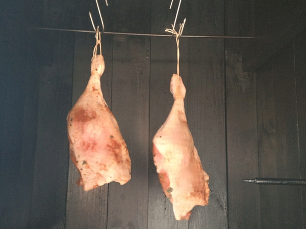 Duck legs are smoked for braising in beer for the dish