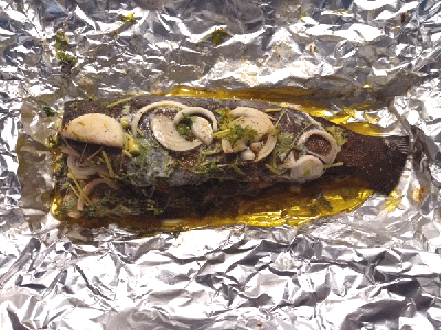 Roasted rainbow trout with spicy green wrapped in tinfoil